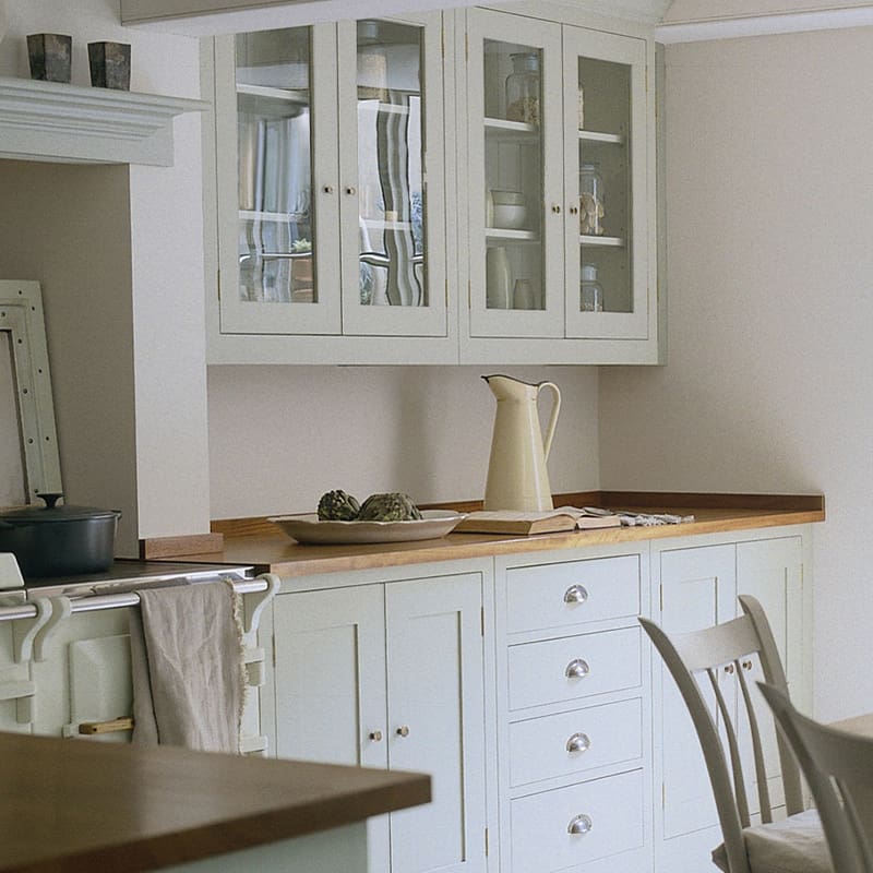 country style white painted wooden kitchen with glass glazed wall cupboards